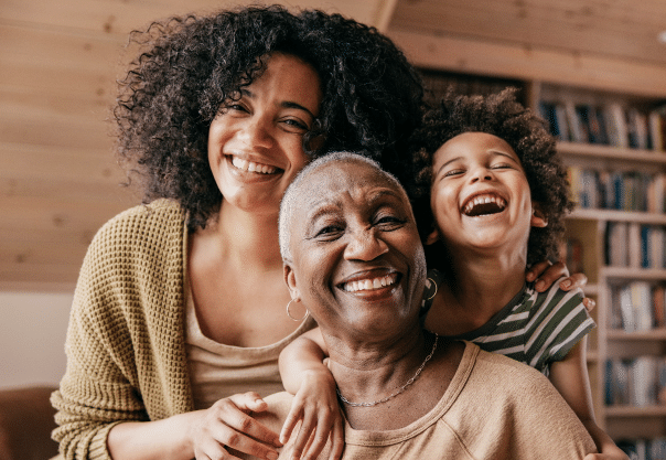 Mother, Grandmother, and child smiling and laughing
