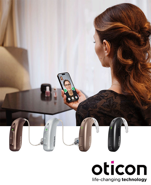 Woman using her phone with her Oticon Real hearing aids connected